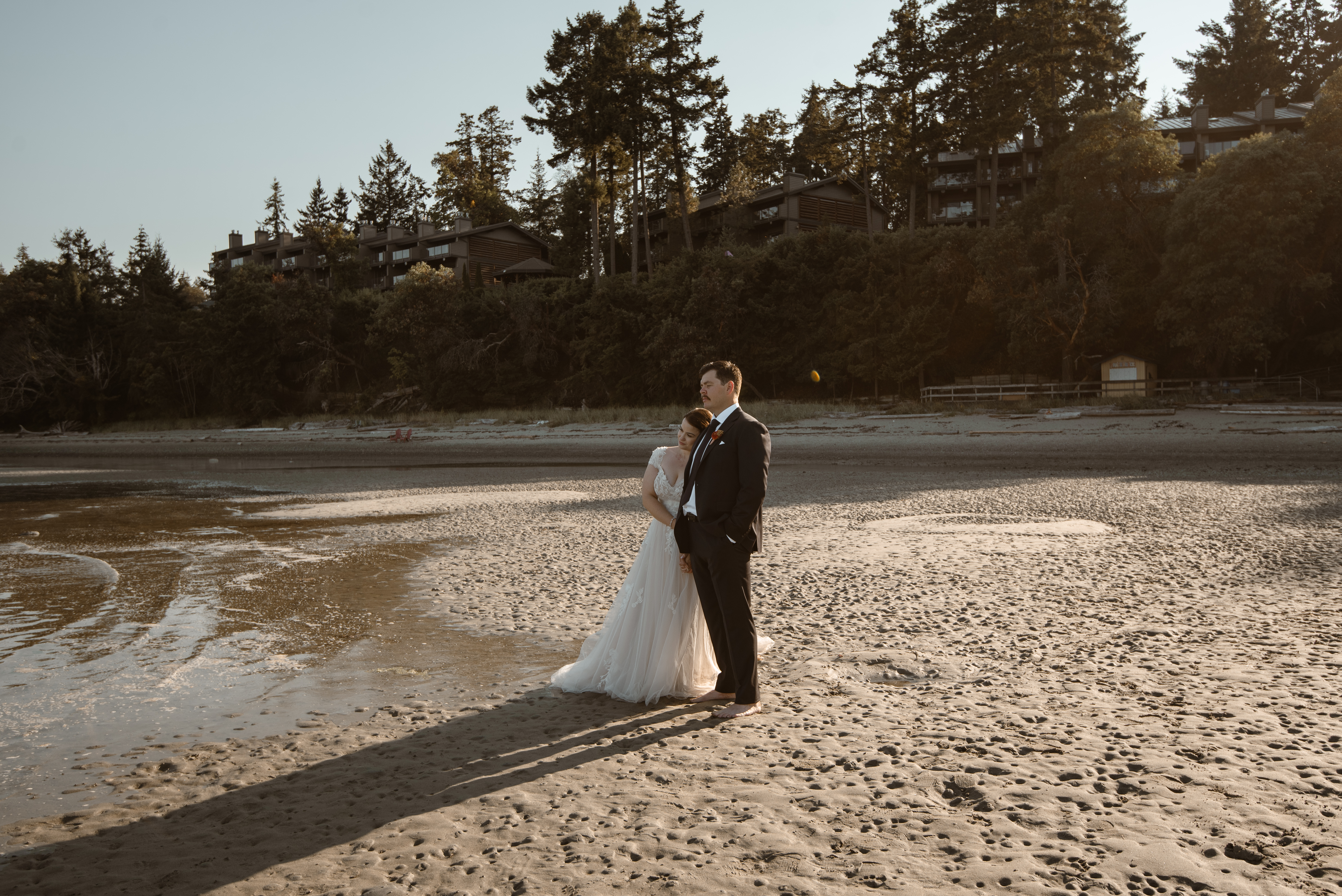 Newly weds stand together and take in the views at Tigh-Na-Mara Resort in Parksville